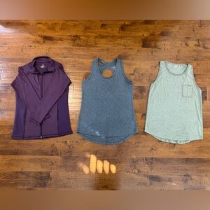 Includes women’s large purple light jacket and gray & green tanks